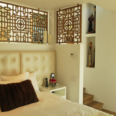 Example of an eclectic bedroom design in Los Angeles with beige walls