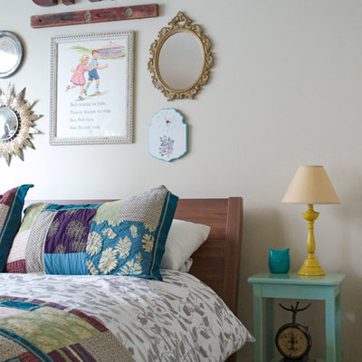 Inspiration for an eclectic bedroom remodel in Dallas with white walls