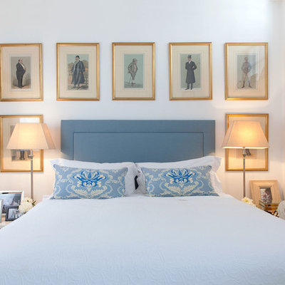 Elegant bedroom photo in London with white walls