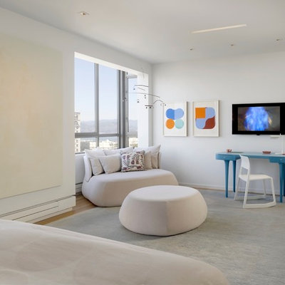Inspiration for a huge modern master light wood floor bedroom remodel in San Francisco with white walls and no fireplace