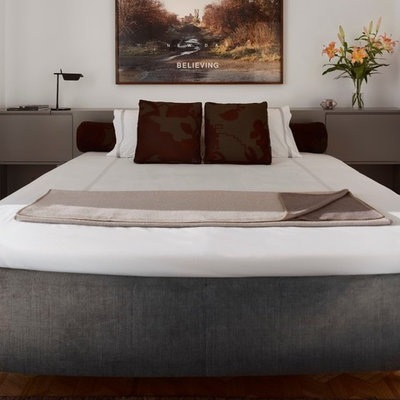 Large trendy master carpeted bedroom photo in San Francisco with white walls and no fireplace