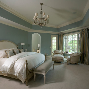 Elegant Master Suite with Tray Ceiling and Fireplace with Limestone Surround