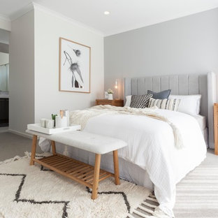 Photo of a scandinavian master bedroom in Melbourne with grey walls, carpet and grey floor.