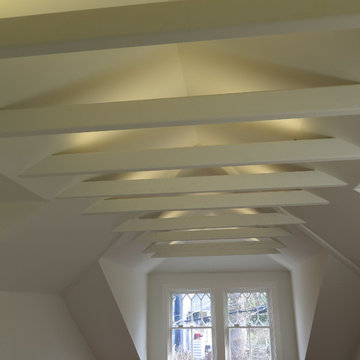 Exposed beams with built-in lighting