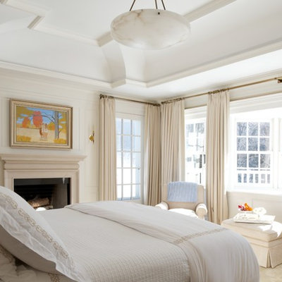 Inspiration for a timeless bedroom remodel in New York with a standard fireplace