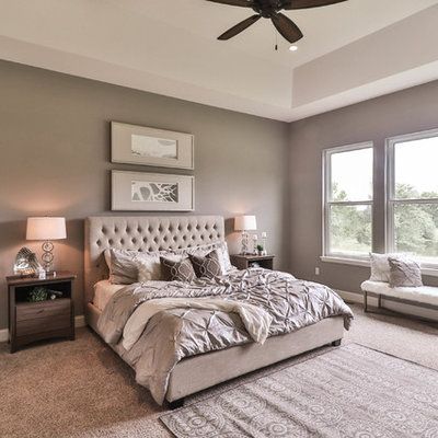Large transitional master carpeted and gray floor bedroom photo in St Louis with beige walls and no fireplace