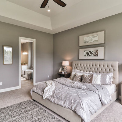 Large transitional master carpeted and gray floor bedroom photo in St Louis with beige walls and no fireplace