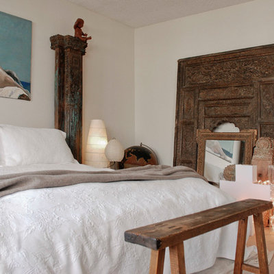 Eclectic bedroom photo in Vancouver with white walls