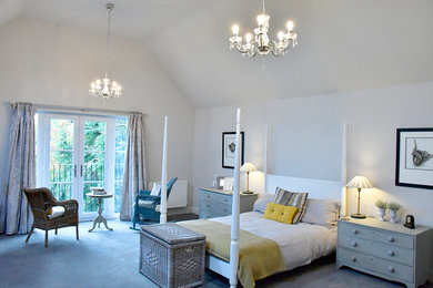 Expansive contemporary master bedroom in Hertfordshire with grey walls, carpet and grey floors.