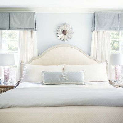 Inspiration for a transitional bedroom remodel in Raleigh with blue walls