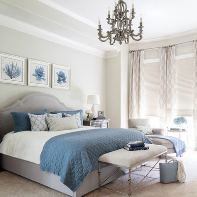Inspiration for a large coastal master carpeted and beige floor bedroom remodel in Houston with gray walls