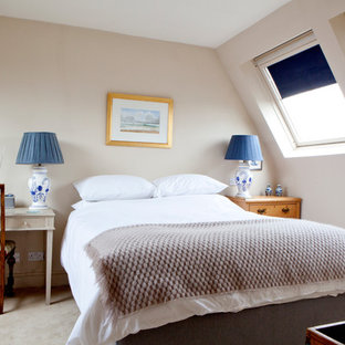 Photo of a medium sized classic guest bedroom in London with carpet, brown walls and beige floors.