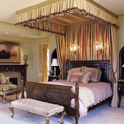 Inspiration for a timeless bedroom remodel in Los Angeles with a standard fireplace