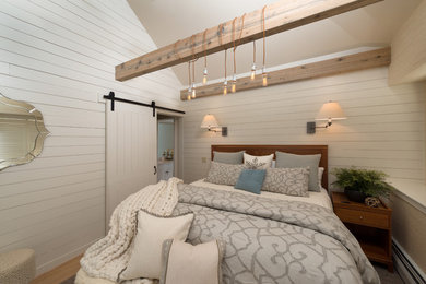 Inspiration for a medium sized rural master bedroom in Burlington with white walls, light hardwood flooring and beige floors.