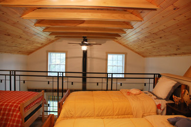 Example of a small farmhouse loft-style carpeted bedroom design in New York with white walls
