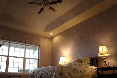 Inspiration for a mid-sized timeless guest bedroom remodel in Denver with beige walls and no fireplace
