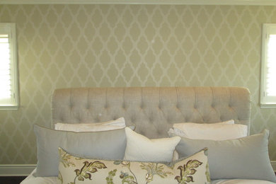 Example of a mid-sized trendy master bedroom design in Orange County with beige walls