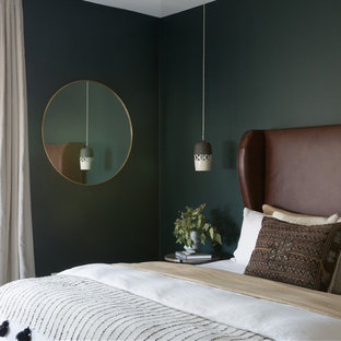Inspiration for a large scandinavian master light wood floor and beige floor bedroom remodel in San Francisco with green walls
