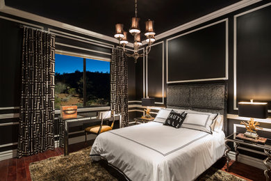 Inspiration for a mid-sized contemporary guest medium tone wood floor bedroom remodel in Phoenix with black walls and no fireplace