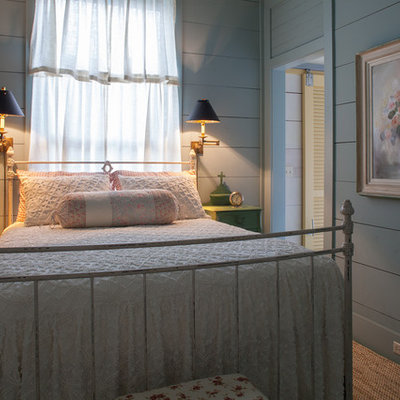 Example of a cottage chic bedroom design in Miami with gray walls