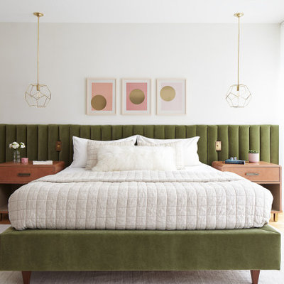 Example of a large trendy master light wood floor and beige floor bedroom design in Philadelphia with white walls
