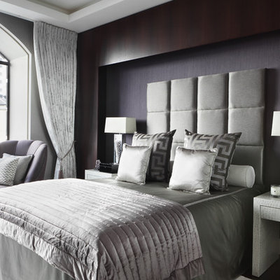Bedroom - contemporary master bedroom idea in London with gray walls