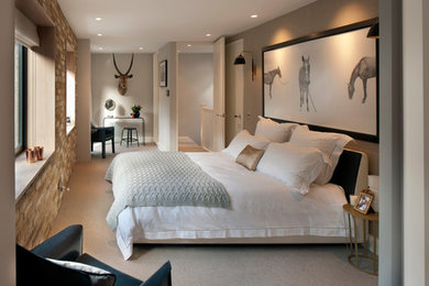 Design ideas for a large contemporary master bedroom in London with beige walls, carpet and beige floors.