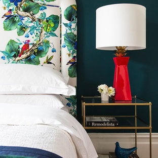 Inspiration for a mid-sized eclectic guest bedroom in Melbourne with green walls and medium hardwood floors.