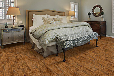 Inspiration for a large timeless master medium tone wood floor bedroom remodel in Other
