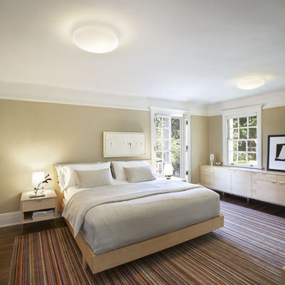 Inspiration for a large modern master dark wood floor bedroom remodel in New York with beige walls