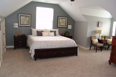 Elegant bedroom photo in Other with gray walls
