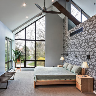 Inspiration for a large contemporary master bedroom in Milwaukee with grey walls, carpet, no fireplace and beige floors.
