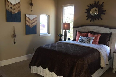 This is an example of a medium sized nautical guest bedroom in Austin with beige walls, carpet, no fireplace and beige floors.