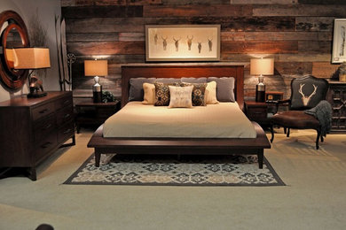 Large transitional master carpeted bedroom photo in Other with brown walls