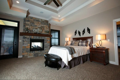 Bedroom - transitional carpeted bedroom idea in Detroit with beige walls, a standard fireplace and a stone fireplace