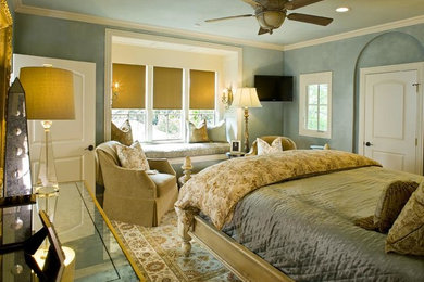 Example of a mid-sized master carpeted bedroom design in Dallas with blue walls