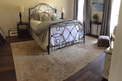 Mid-sized elegant dark wood floor bedroom photo in Atlanta with beige walls and no fireplace