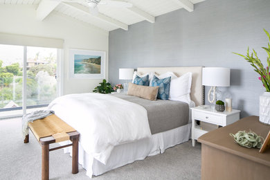 Beach style master carpeted and gray floor bedroom photo in Orange County with gray walls
