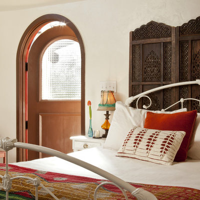 Bedroom - eclectic bedroom idea in Other with white walls