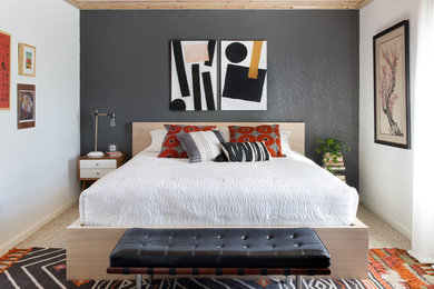 Example of an eclectic carpeted and beige floor bedroom design in Austin with gray walls