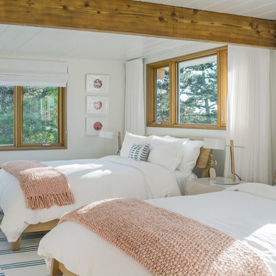 Inspiration for a large coastal guest bedroom remodel in Boston with white walls