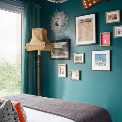 Small eclectic bedroom photo in Other with green walls and no fireplace