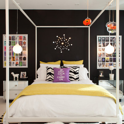 Inspiration for a large contemporary bedroom remodel in Miami with black walls and no fireplace