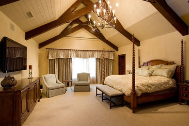 Example of a large classic master carpeted and beige floor bedroom design in New York with beige walls and no fireplace
