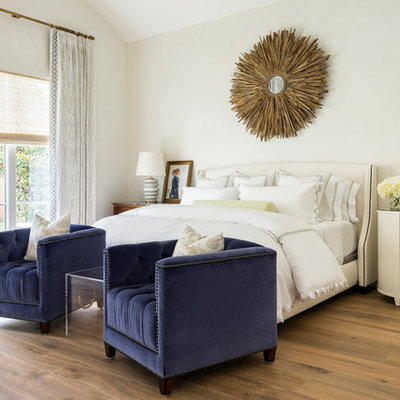 Bedroom - transitional master medium tone wood floor bedroom idea in Houston with beige walls and no fireplace