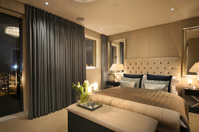 This is an example of a contemporary bedroom in London with feature lighting.