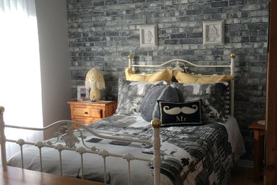 Example of a master wallpaper bedroom design in Toronto with gray walls