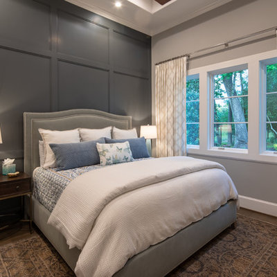 Bedroom - transitional dark wood floor and brown floor bedroom idea in Houston with gray walls