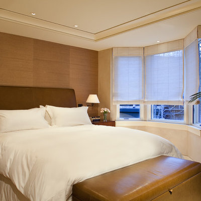 Inspiration for a contemporary bedroom remodel in Denver with beige walls