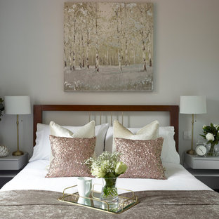 Example of a minimalist guest carpeted and gray floor bedroom design in Essex with gray walls